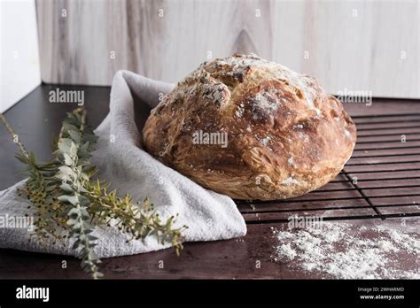 Loaf of homemade bread on cooling rack and baking sheet Stock Photo - Alamy