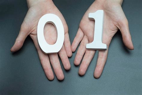 Premium Photo | On the palms of the digit one and zero