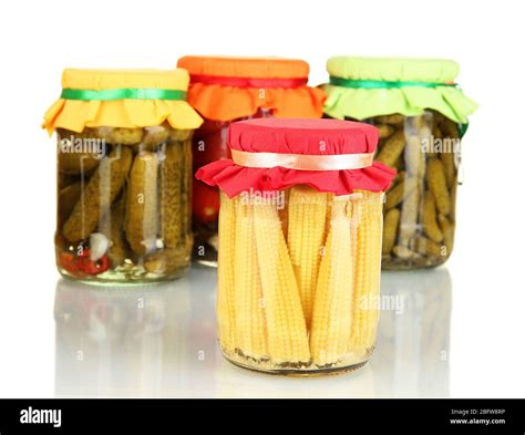 Jars with canned vegetables isolated on white Stock Photo - Alamy