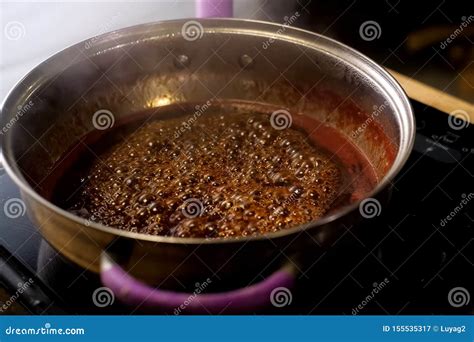Boiling Jam, Jam To Jam. Boiling on Fire in Steel Plate Stock Image ...