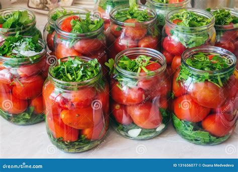 Fermenting Vegetables with Lots of Greens in Glass Jars. Processing the ...