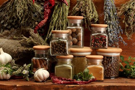 Dried herbs, spices and and pepper, on wooden background Stock Photo by ...