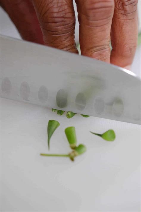 Trimming green beans with a knife