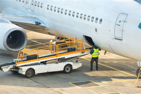 Preparation for Unloading Baggage from an Airplane Stock Image - Image ...