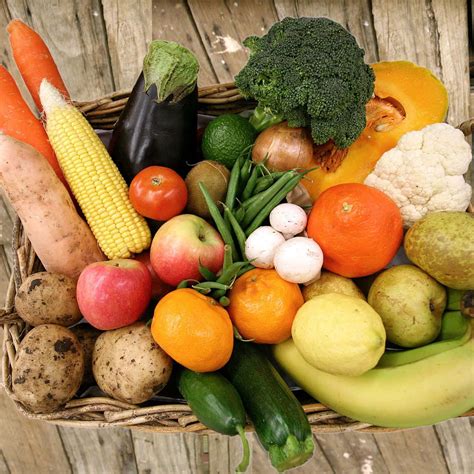Download Overhead Shot Of Fruits And Vegetables On A Wicker Tray ...