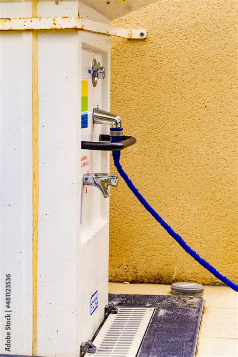 Caravan service. Refilling camper rv water tank. Stock Photo | Adobe Stock