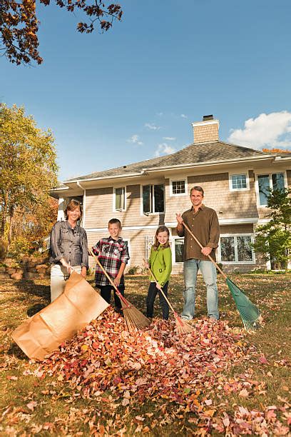 Family Raking Leaves Stock Photos, Pictures &amp; Royalty-Free Images - iStock