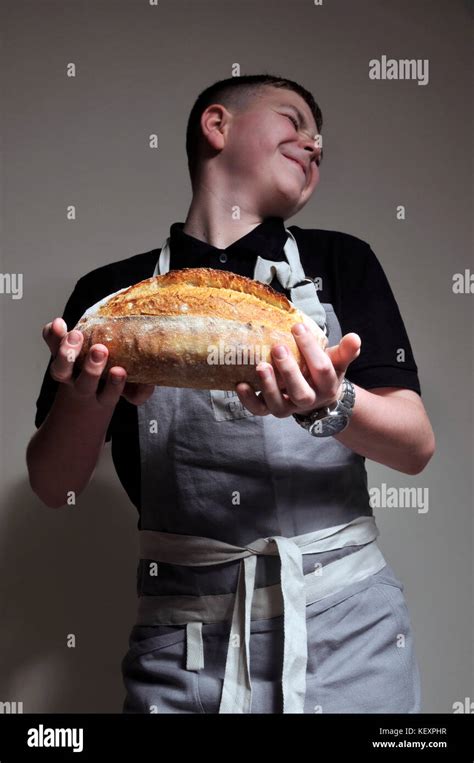 Young boy baking bread Stock Photo - Alamy