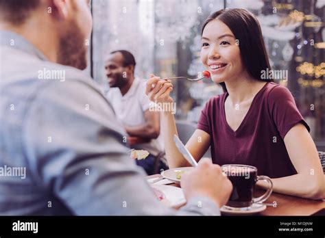 Couple enjoying meal at cafe hi-res stock photography and images - Alamy