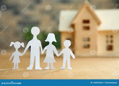 Composition with Paper Family Cutout and House Model Stock Photo ...