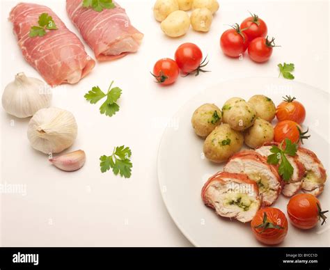 Cooked meal on a plate including all the raw ingredients Stock Photo ...