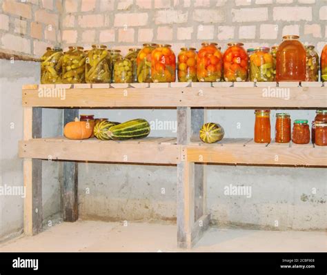 Glass jars for storing food with canned vegetables, fruits and berries ...