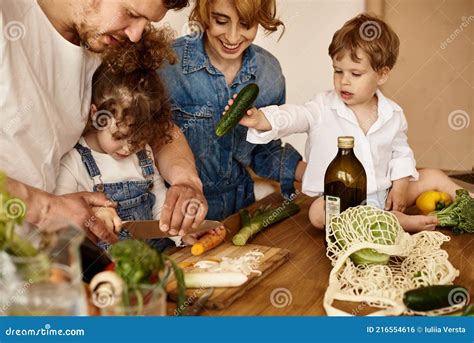 Happy Family with Their Children Cooking in the Kitchen Stock Photo ...