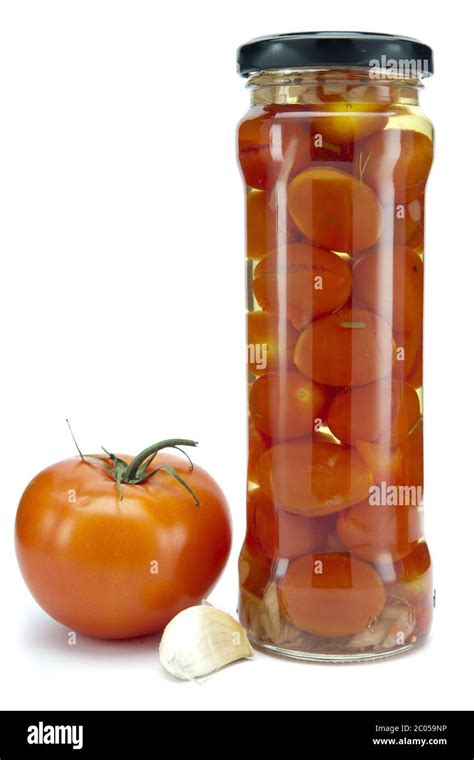 Canned tomatoes in glass jars Stock Photo - Alamy