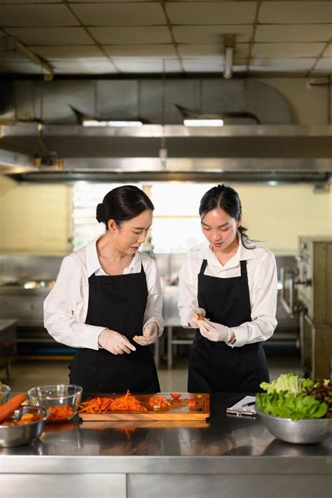 Cooking Instructor Giving Hands on Guidance To a Student on Food ...