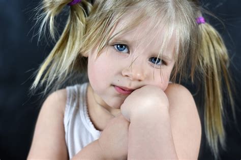 Premium Photo | Romantic portrait of a little girl on a black background