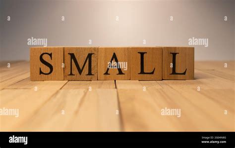 The word small created from wooden cubes Stock Photo - Alamy