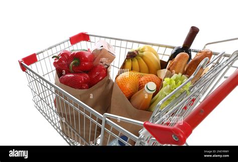 Shopping cart full of groceries on white background Stock Photo - Alamy