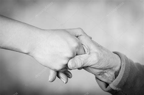 Two People Holding Hands Black And White