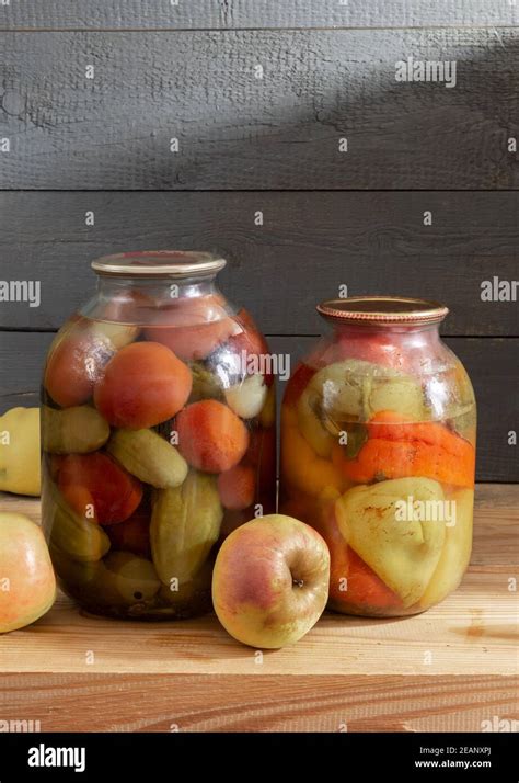 Canned vegetables in glass jars on a shelf in the basement Stock Photo ...