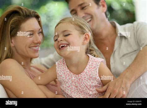 Portrait of happy family laughing together Stock Photo - Alamy