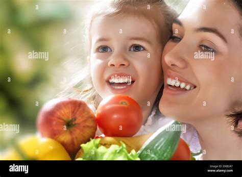 happy family keeps fresh vegetables Stock Photo - Alamy