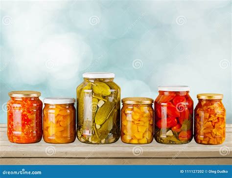 Jars with Canned Vegetables on Wooden Table Stock Photo - Image of ...