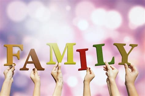 Premium Photo | Cropped hands holding family text