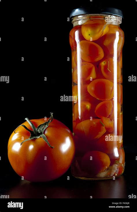 canned tomatoes in glass jars Stock Photo - Alamy