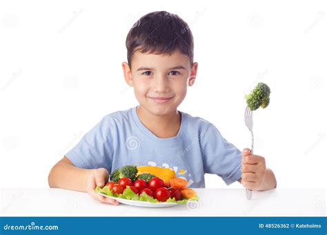 Boy Eating Vegetables Stock Photo - Image: 48526362