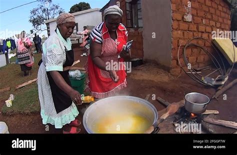 Rural women cooking traditional food for a ceremony Stock Video Footage ...
