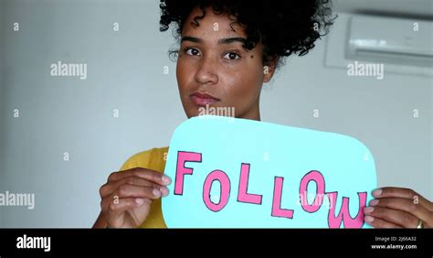 Female vlogger asking audience to follow on social media Stock Photo ...