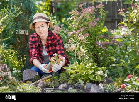 Woman outdoor flowers hi-res stock photography and images - Alamy