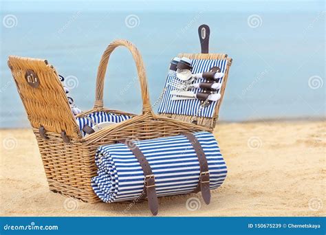 Wicker Basket with Picnic Essentials on Sand Stock Image - Image of ...