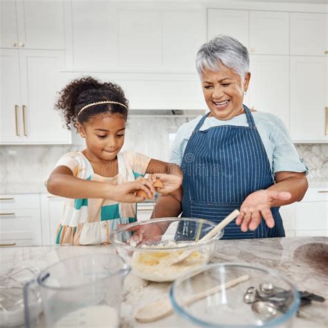 Learning, Cooking Grandmother and Girl with Egg and Flour in Bowl in ...