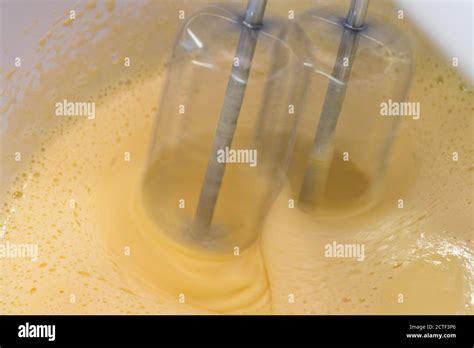 Mixing biscuit dough with an electric mixer. close up process. Cake ...