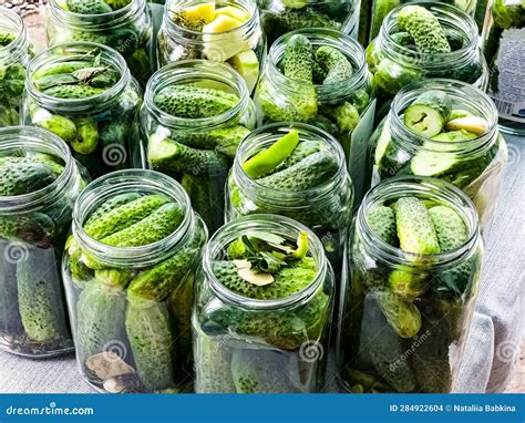 The Process of Pickling Cucumbers for the Winter in Glass Jars ...