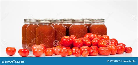 Field Tomatoes with Jars of Canned Tomato Sauce Stock Photo - Image of ...