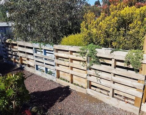 What DIY methods secure a rustic garden fence against pests?