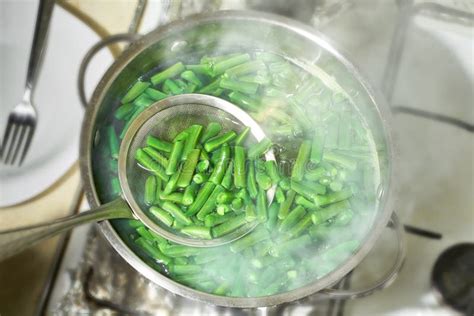 Boiled Green Beans in a Pot, Top View. Green Bush Beans Boiling in Hot ...