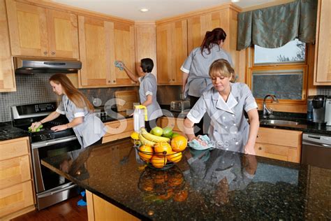 Cleaning Kitchen. Teamwork Stock Photo – Royalty-Free Images | FreeImages