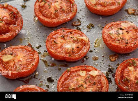 Roasted tomato halves Stock Photo - Alamy