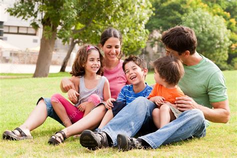 Happy family having fun in the park — Stock Photo © get4net #3605695