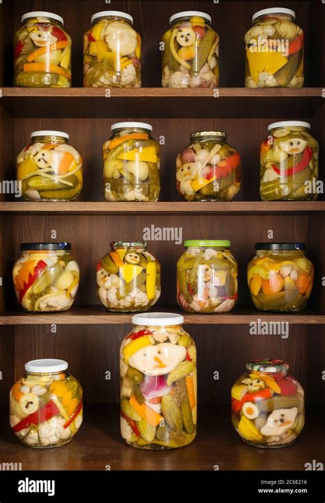 Home Canning of Summer Vegetables Stored on Wooden Shelves. Grandmother ...
