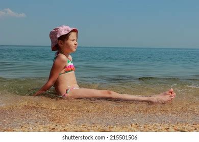 Little Girl Swimsuit Sits Sand On Stock Photo 215504371 | Shutterstock
