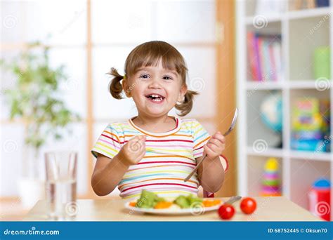 Happy Child Girl Eating Vegetables. Healthy Nutrition for Kids Stock ...