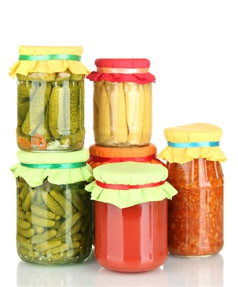 Premium Photo | Jars with canned vegetables isolated on white