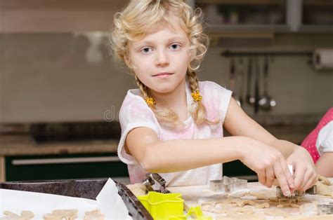 Child helping in kitchen stock photo. Image of child - 63390404