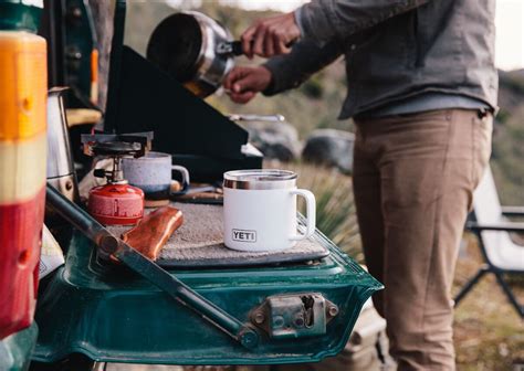 What minimal cooking gear & real food staples should I pack for a country road trip?