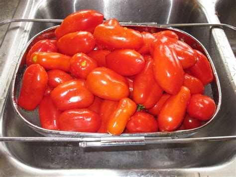How to safely can surplus garden tomatoes for winter meals?